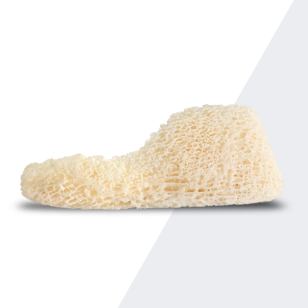 Close-up of Puros® Allograft Customized Block, a cancellous bone graft solution designed for predictable bone regeneration and contouring in dental and surgical procedures.